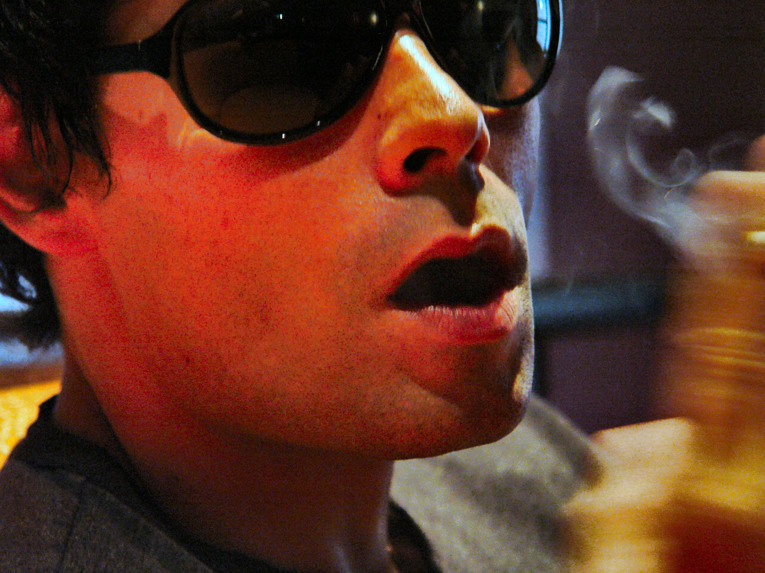 Young man, wreathed in smoke